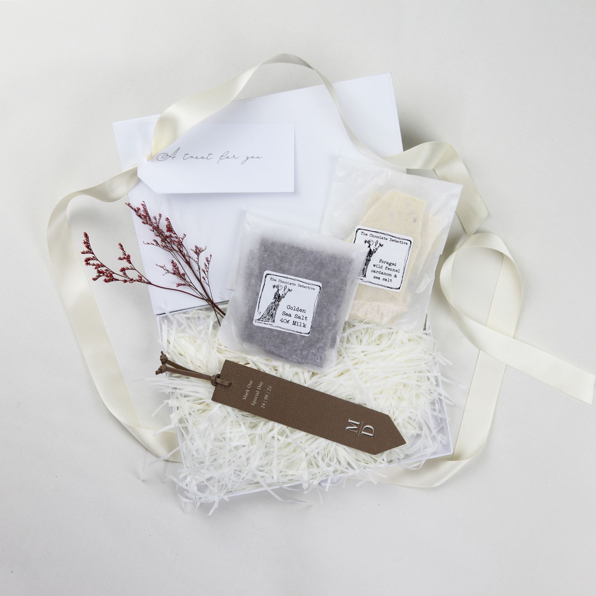 Gift box for readers and writers with branded leather bookmark and milk, dark, white chocolate