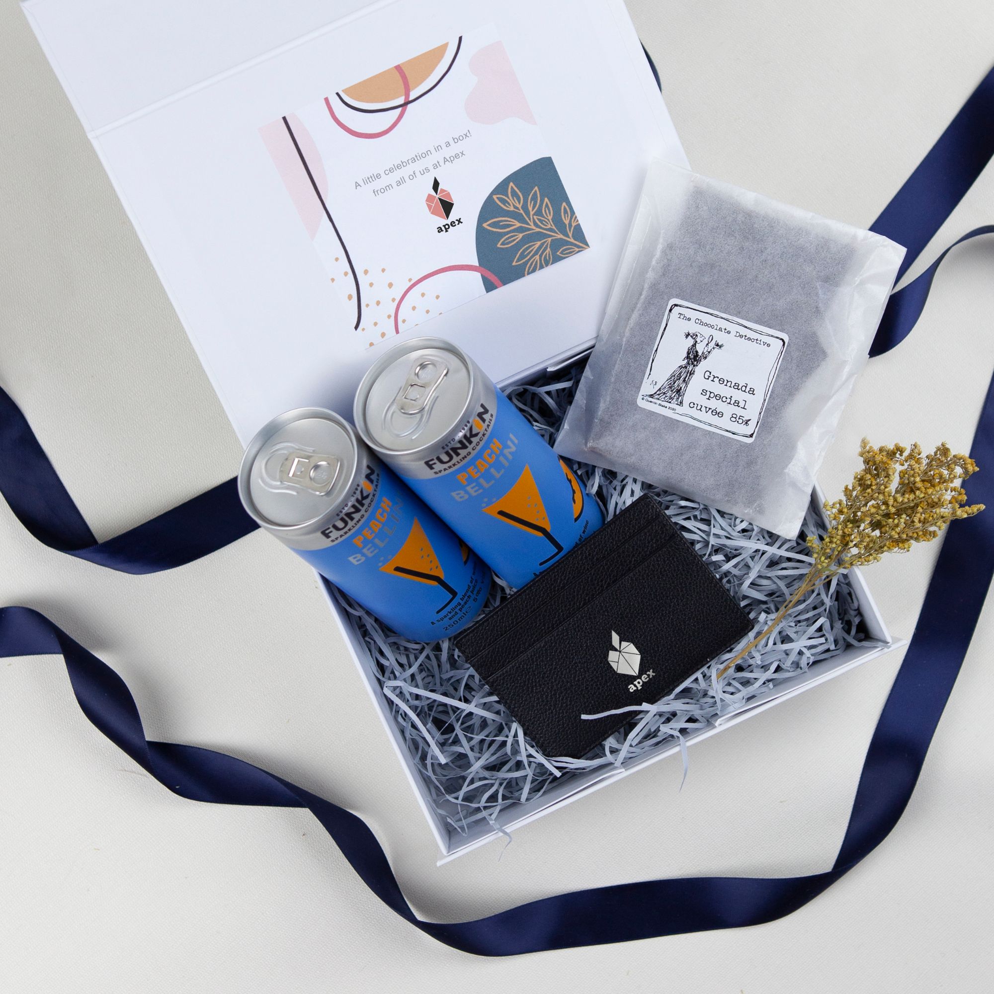 Celebration gift box with branded leather card case, chocolates and cocktails