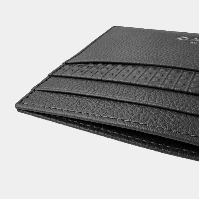 Leather flat card case with 4 card slots either side to hold credit cards and business cards