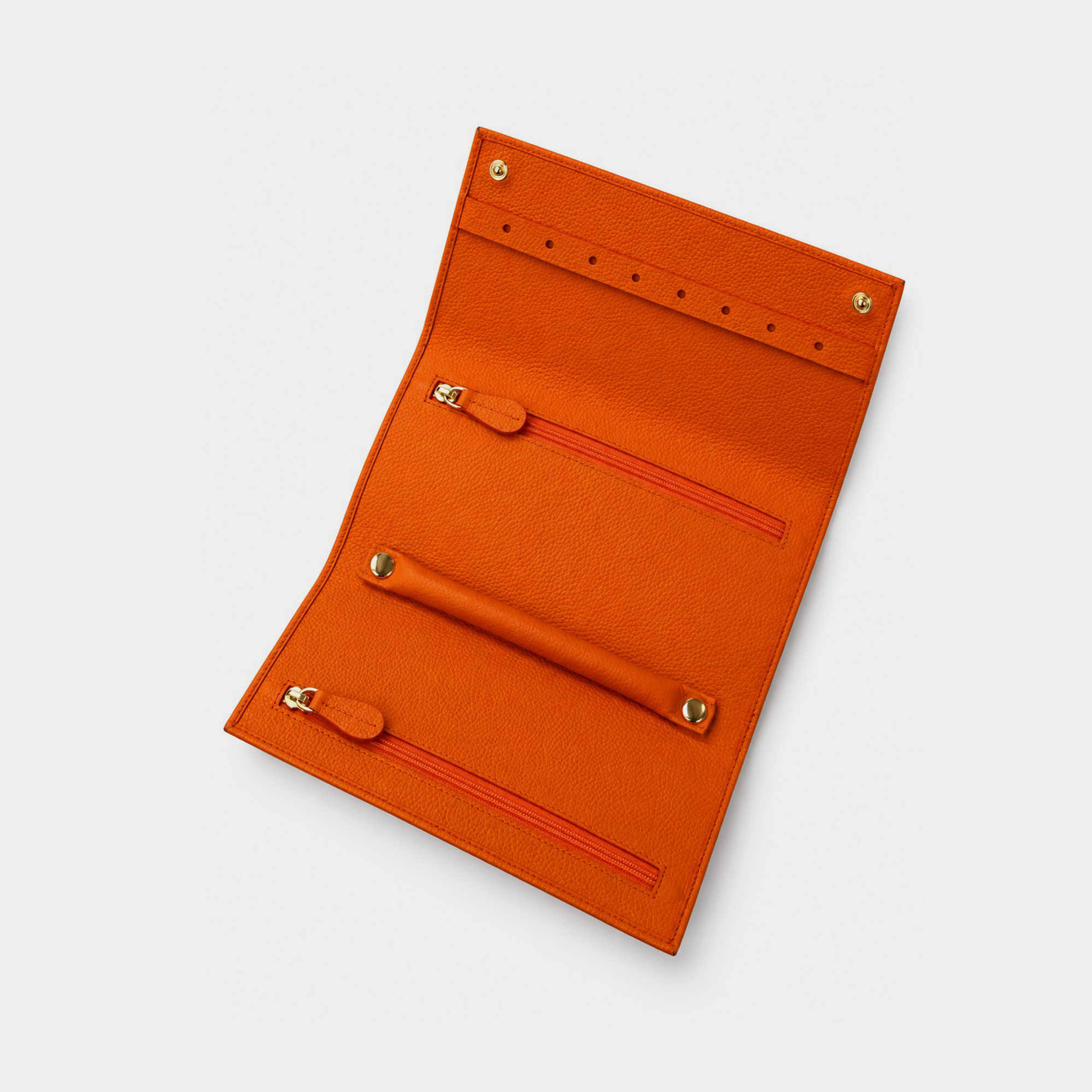 Personalised leather jewellery roll with zip compartments, ring loops and earring holes.