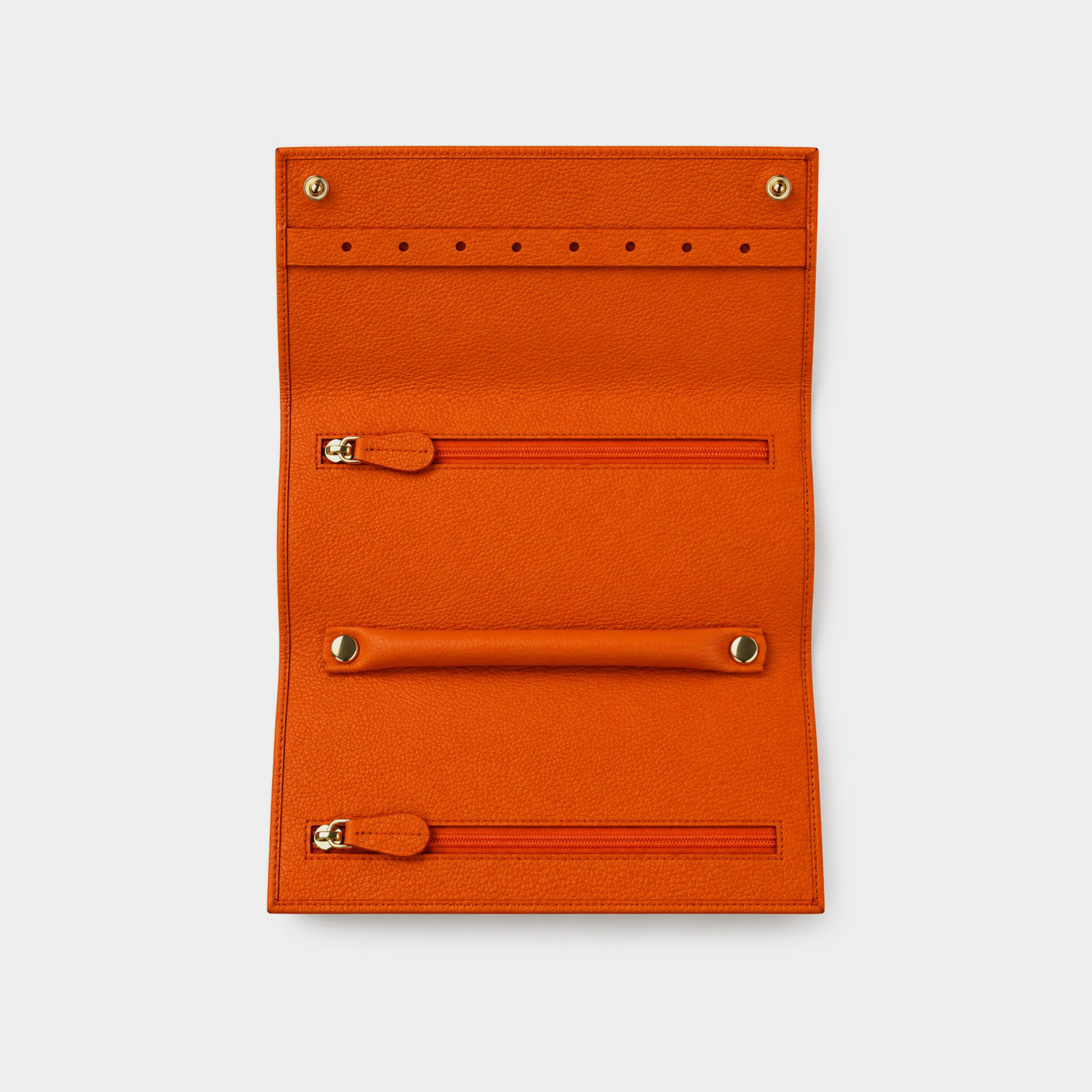 Personalised leather jewellery roll with zip compartments, ring loops and earring holes.