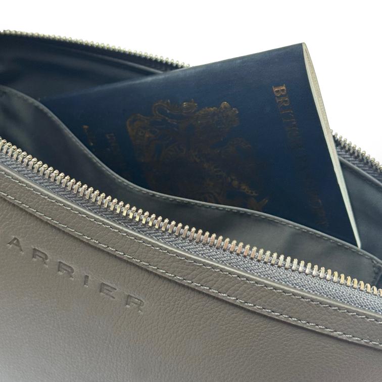 Leather travel pouch with across body strap to hold your travel essentials